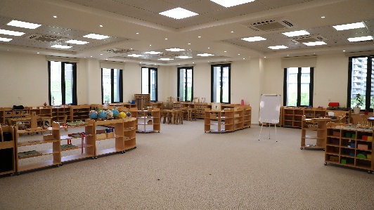 A child reading in the classroom library corner
